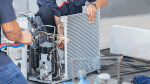 air conditioning technicians repairing a unit